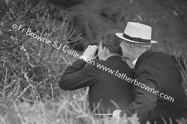 HERONS NEST IN CLIFF REV MC GRATH AND PRENDERGAST WATCHING